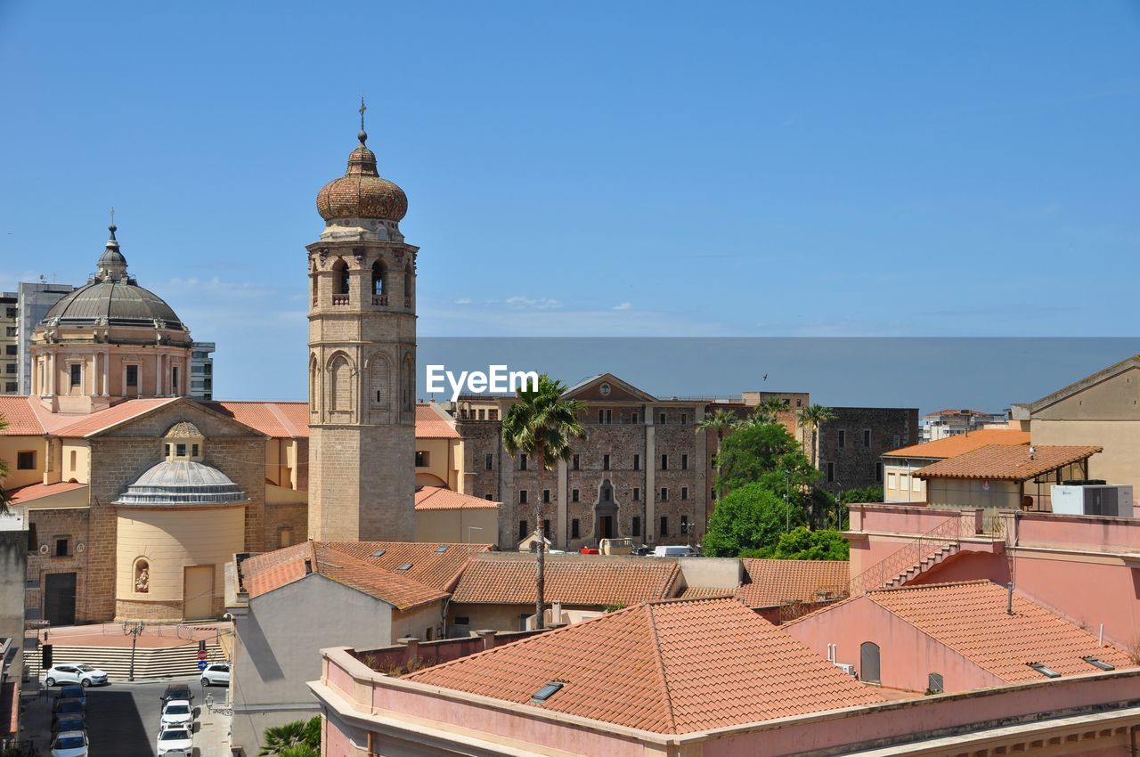 Buildings in city against sky