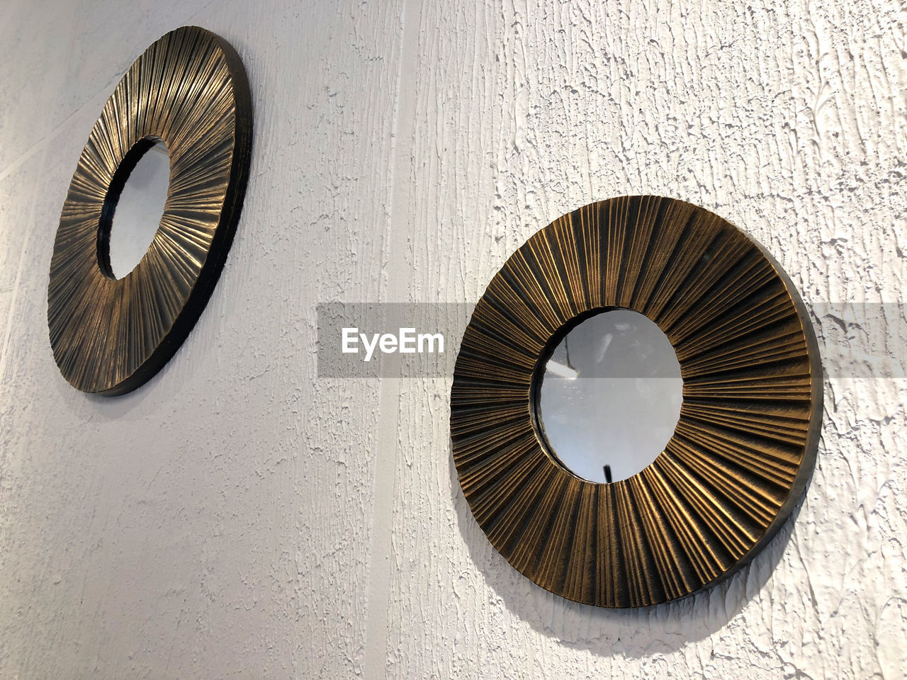 wall - building feature, circle, brown, no people, geometric shape, wood, wheel, shape, close-up, built structure, architecture, iron, pattern