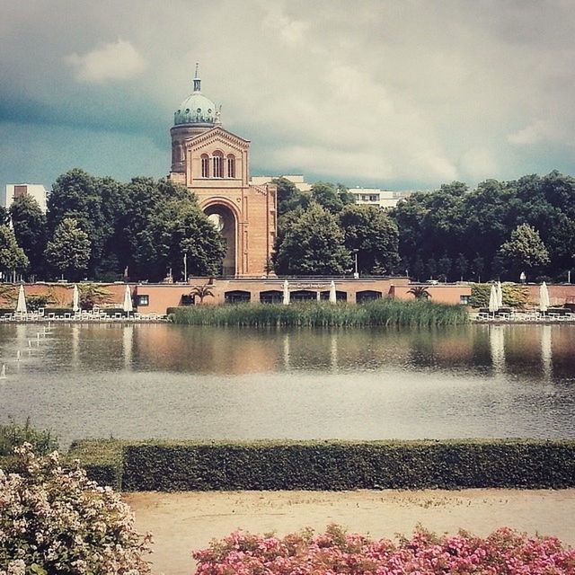 VIEW OF RIVER WITH BUILDINGS IN BACKGROUND