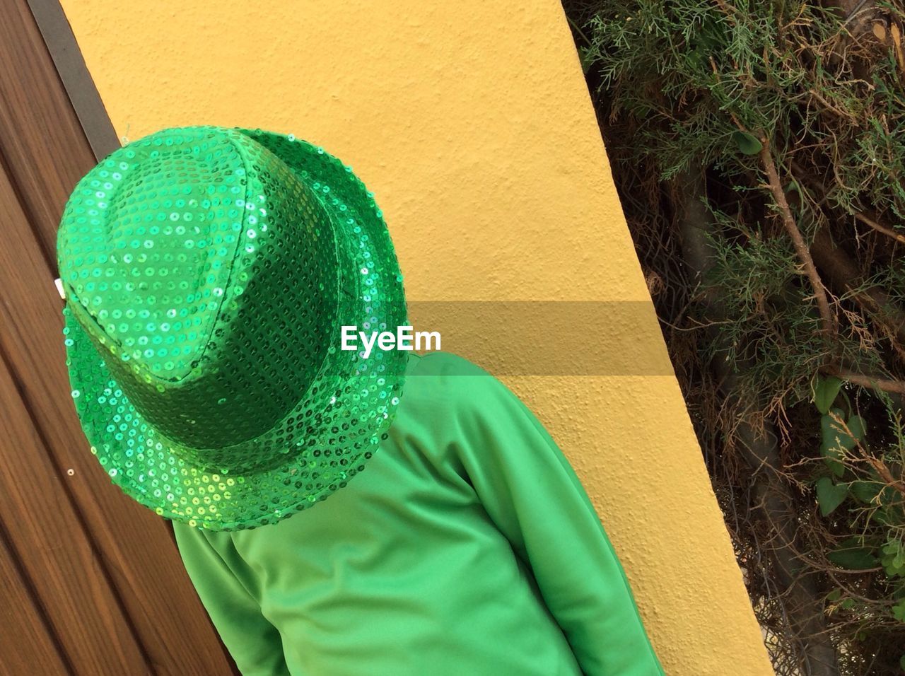 Close-up of a boy wearing green cap