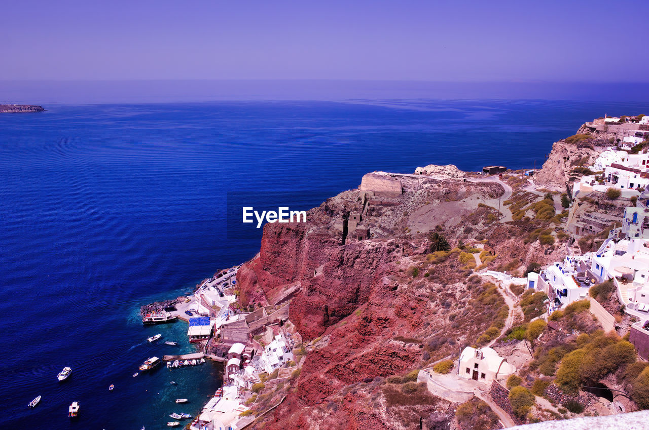 Imerovigli, santorini, greece. view to the clifftop village in daytime. wide angle shot of houses