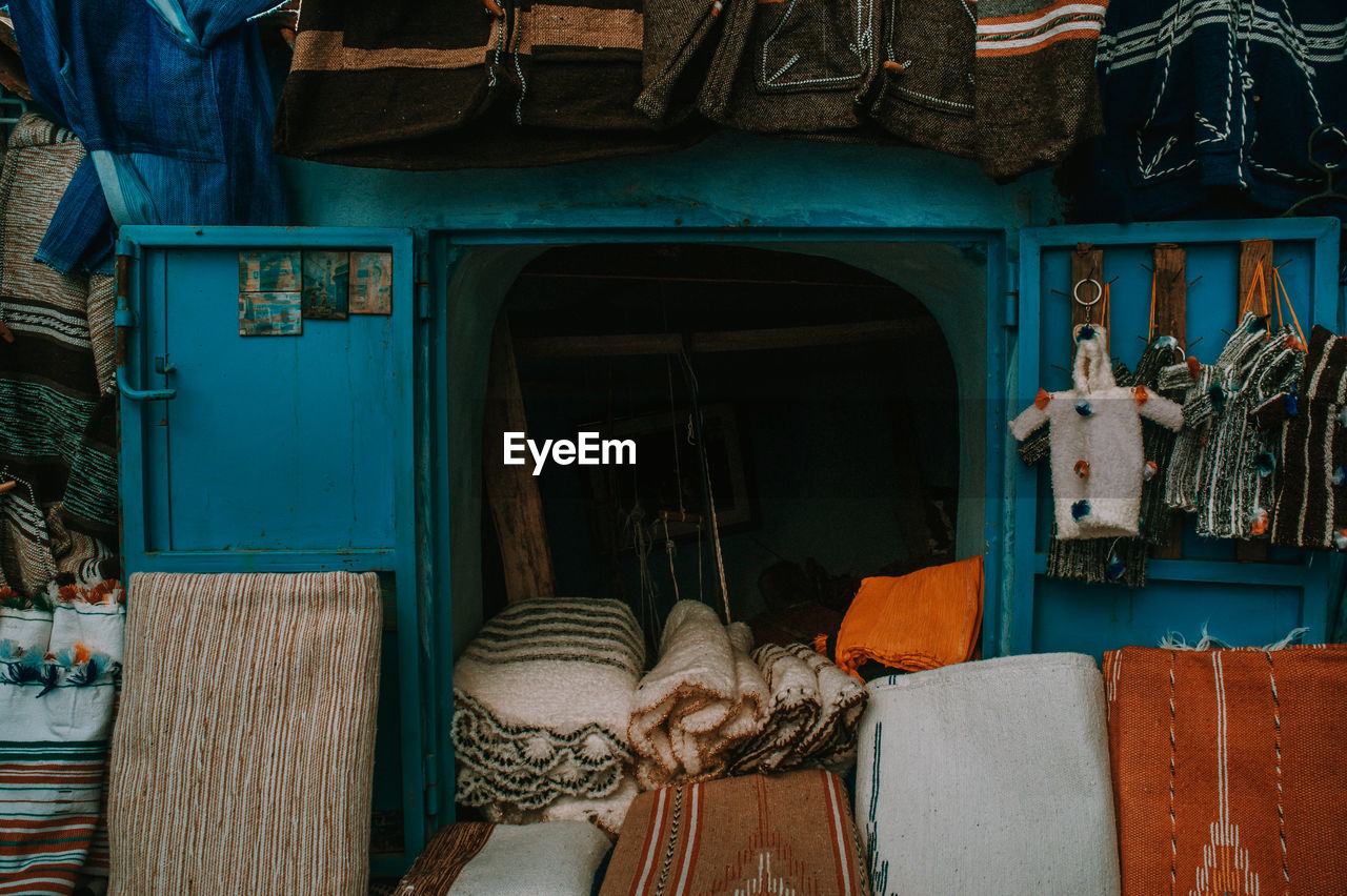 Rear view of man outside building/ view of a market 