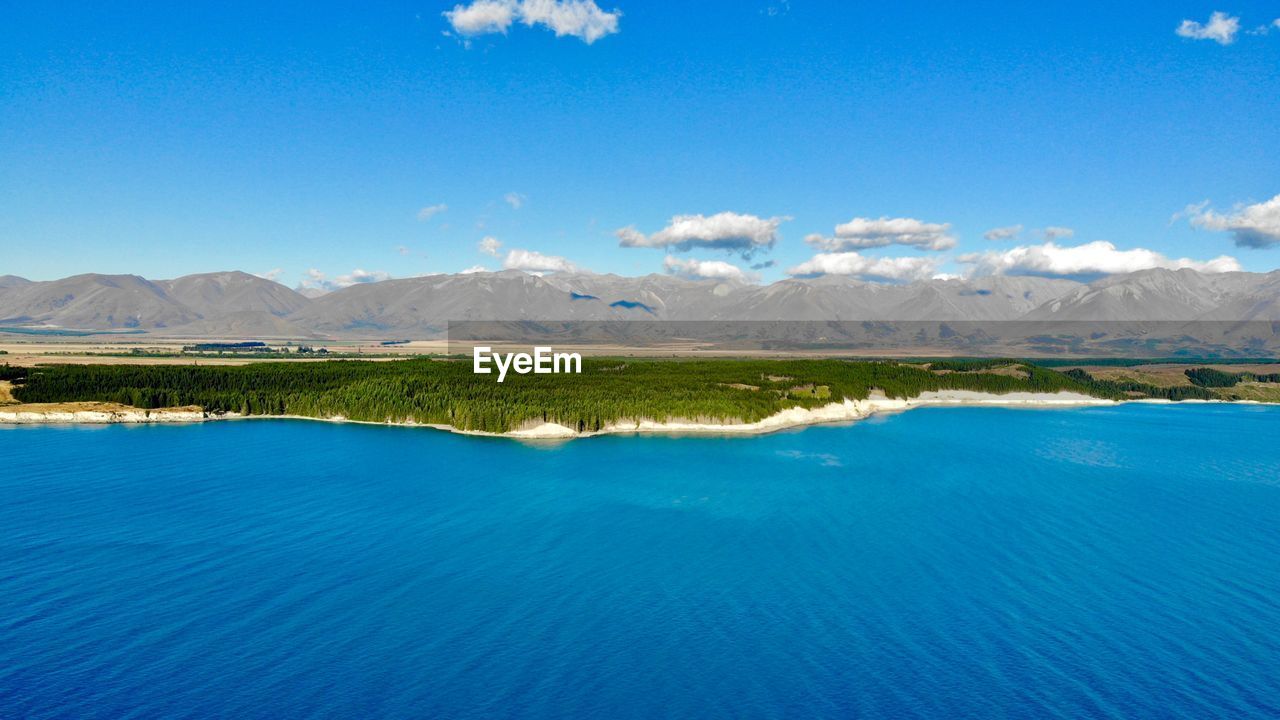 Scenic view of lake against blue sky