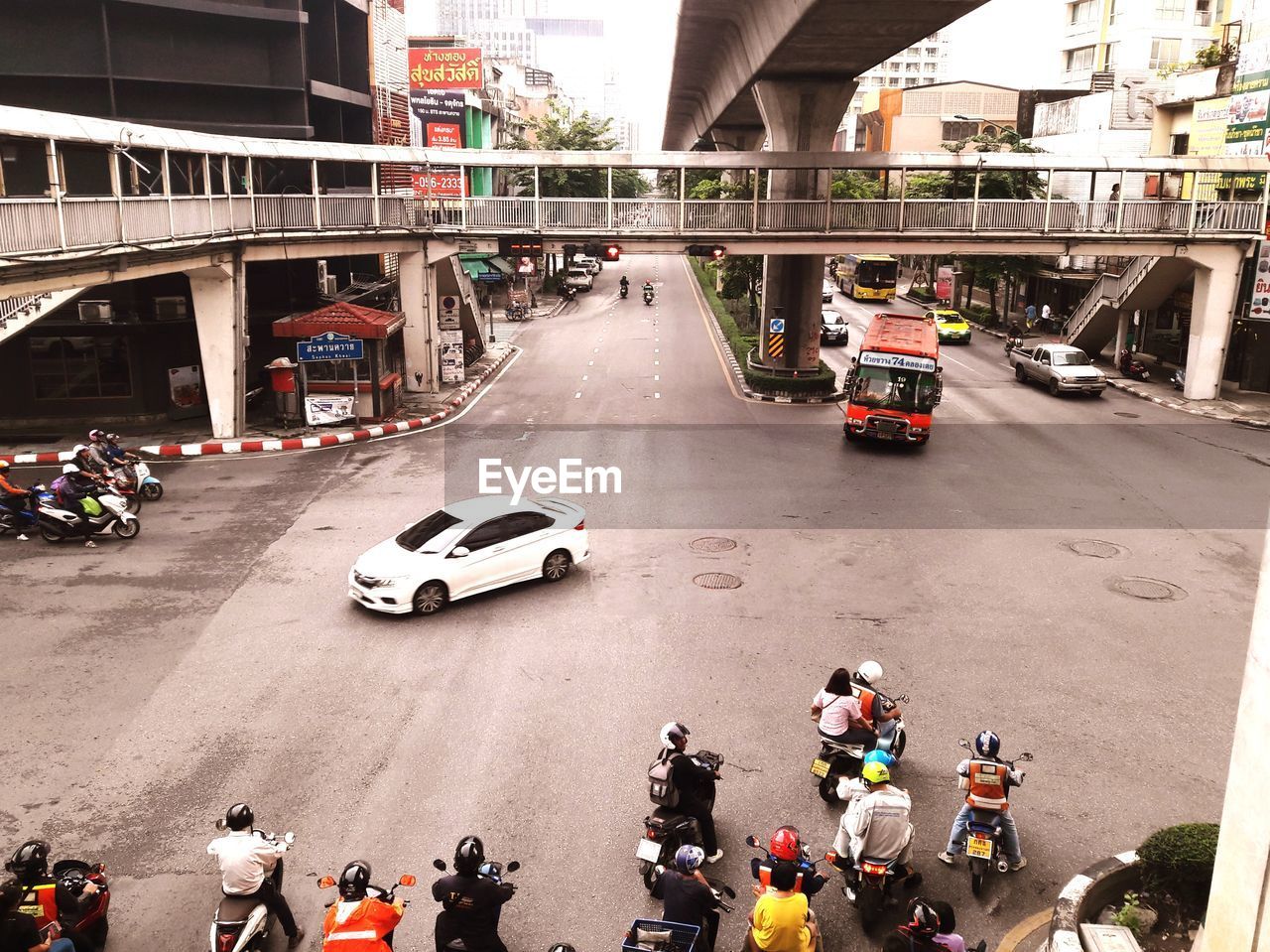 HIGH ANGLE VIEW OF PEOPLE ON STREET