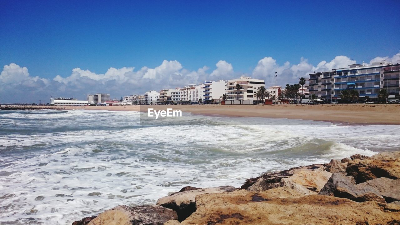 Scenic view of beach and sea against sky