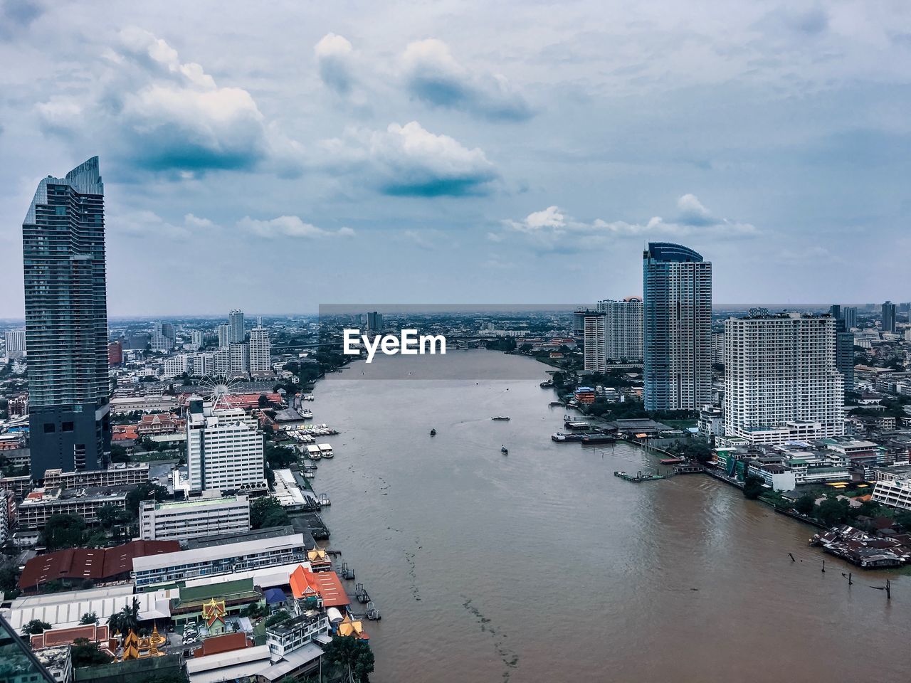 HIGH ANGLE VIEW OF BUILDINGS AGAINST SKY