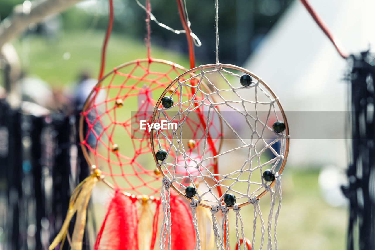 close-up of decoration hanging on rope