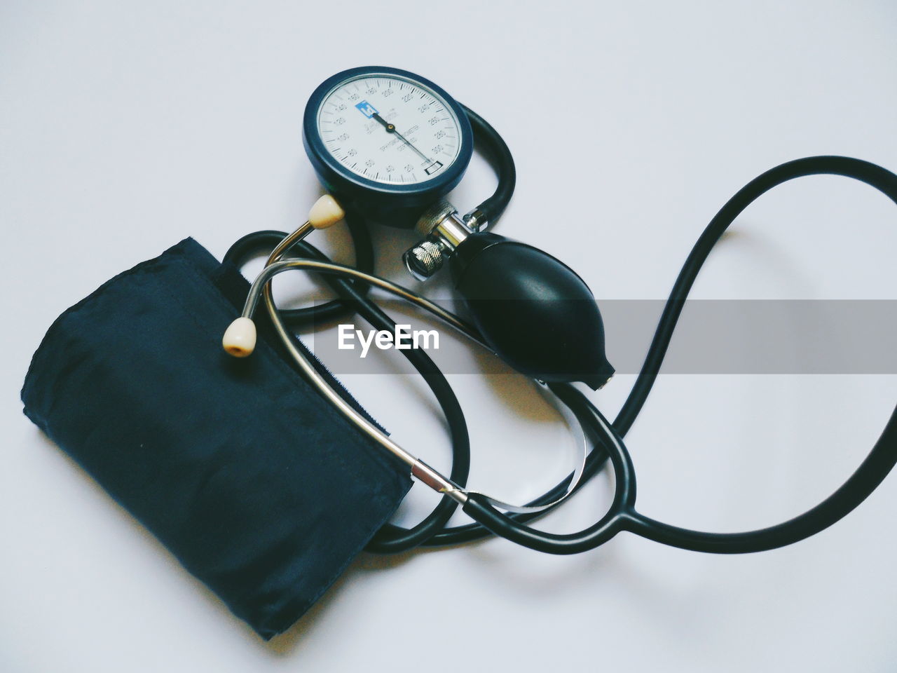 Close-up of blood pressure gauge on table