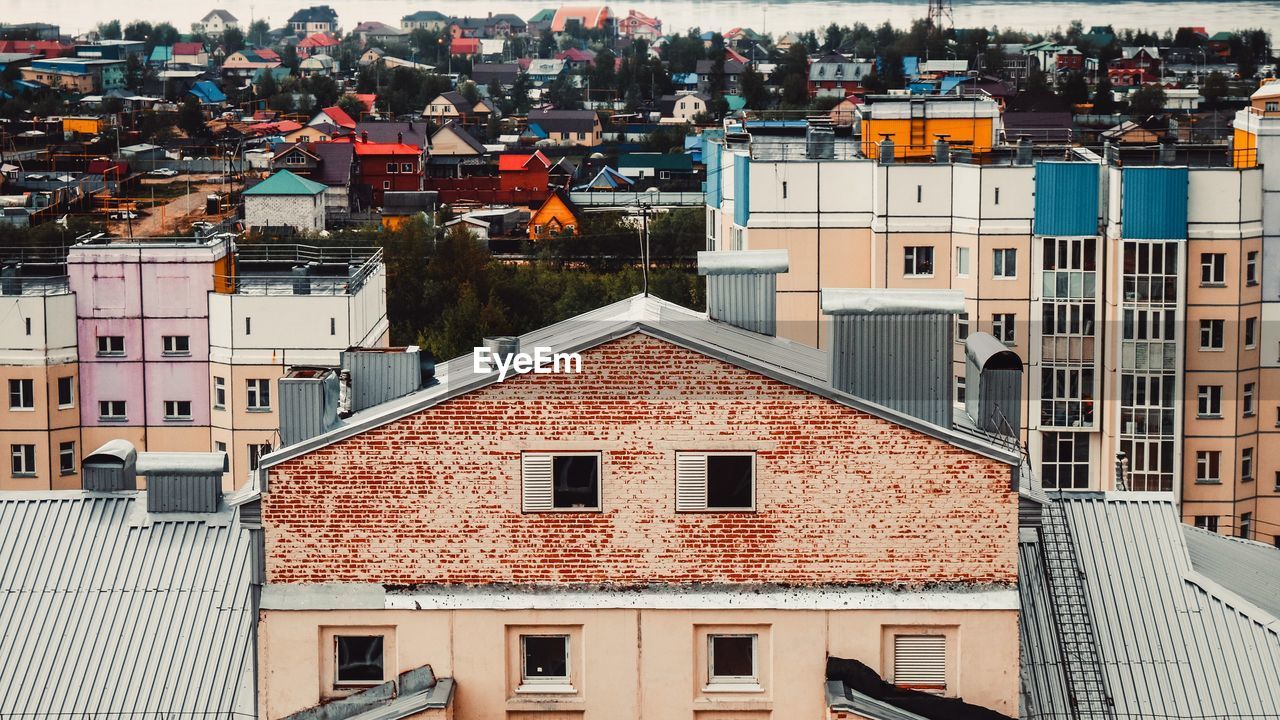 Houses in town against sky