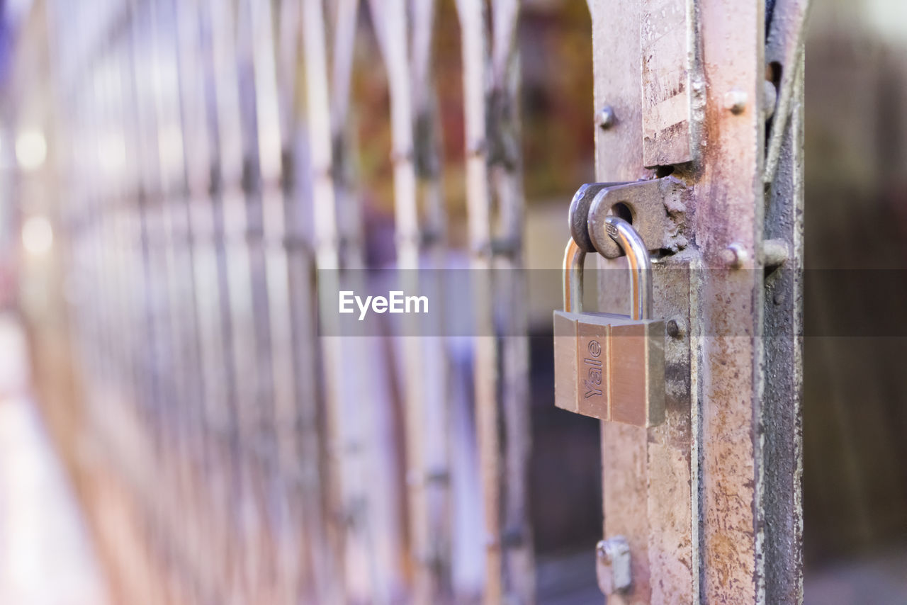 CLOSE-UP OF PADLOCK ON GATE