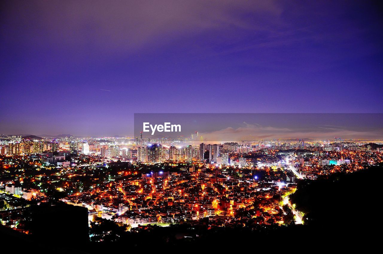 Aerial view of cityscape at dusk