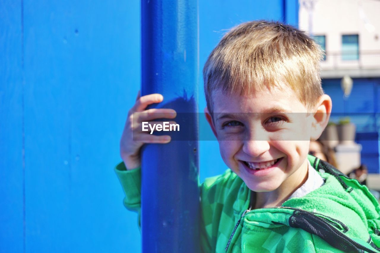 Portrait of boy smiling outdoors