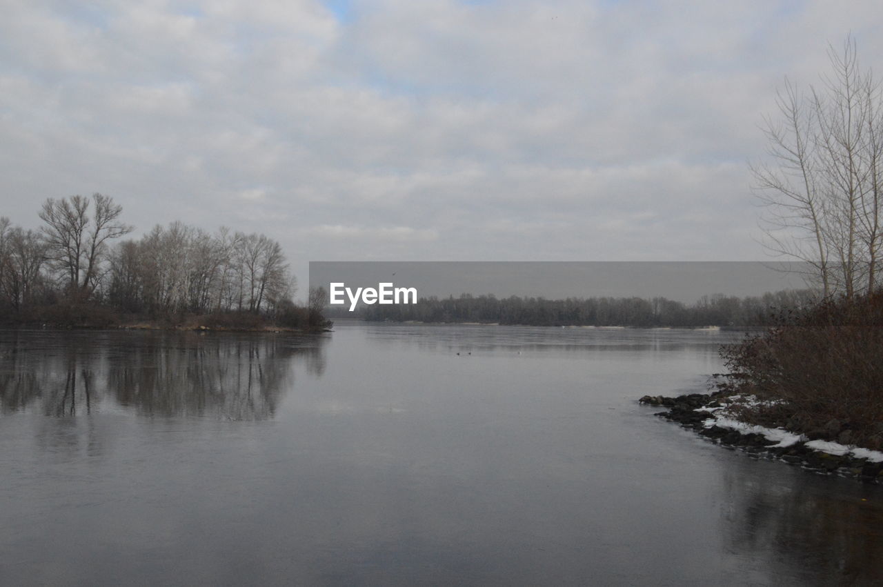 VIEW OF LAKE AGAINST SKY DURING WINTER