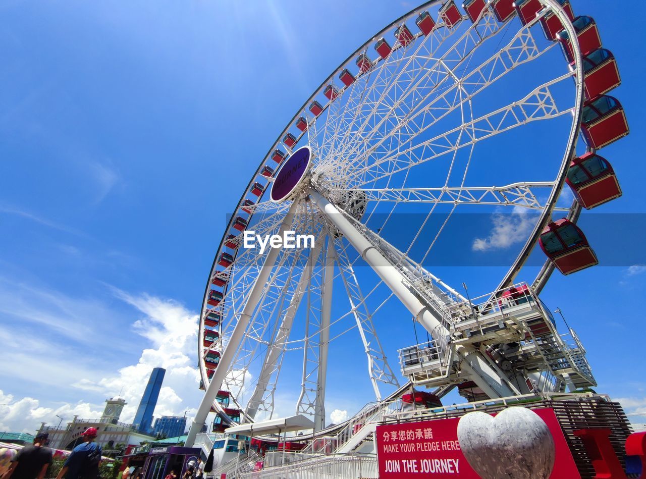 ferris wheel, amusement park ride, amusement park, sky, arts culture and entertainment, nature, travel destinations, carnival, traveling carnival, blue, architecture, fair, wheel, leisure activity, travel, outdoors, day, tourism, low angle view, recreation, park, city, fun, transportation, clear sky, built structure, cloud, amusement ride, circle