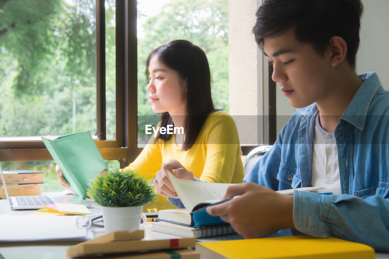 Students studying on table