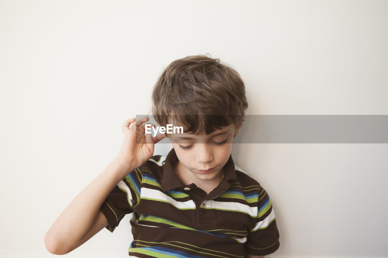 Boy against white background