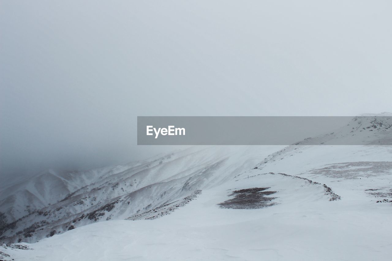 Scenic view of mountains during winter