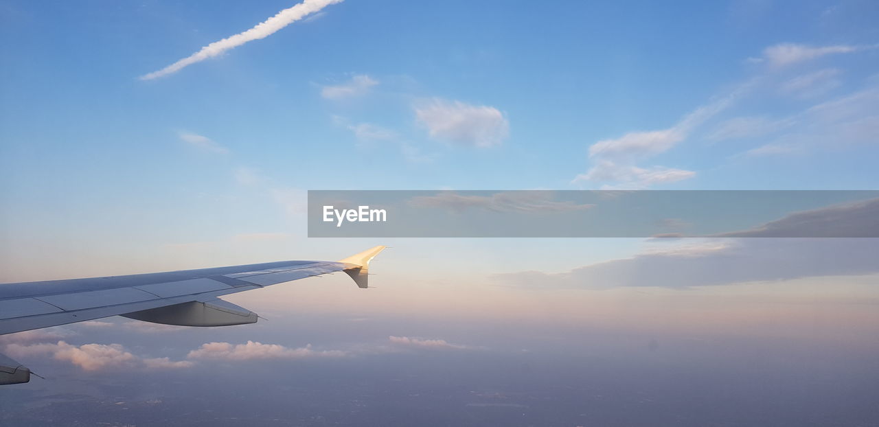 AERIAL VIEW OF CLOUDS OVER BLUE SKY