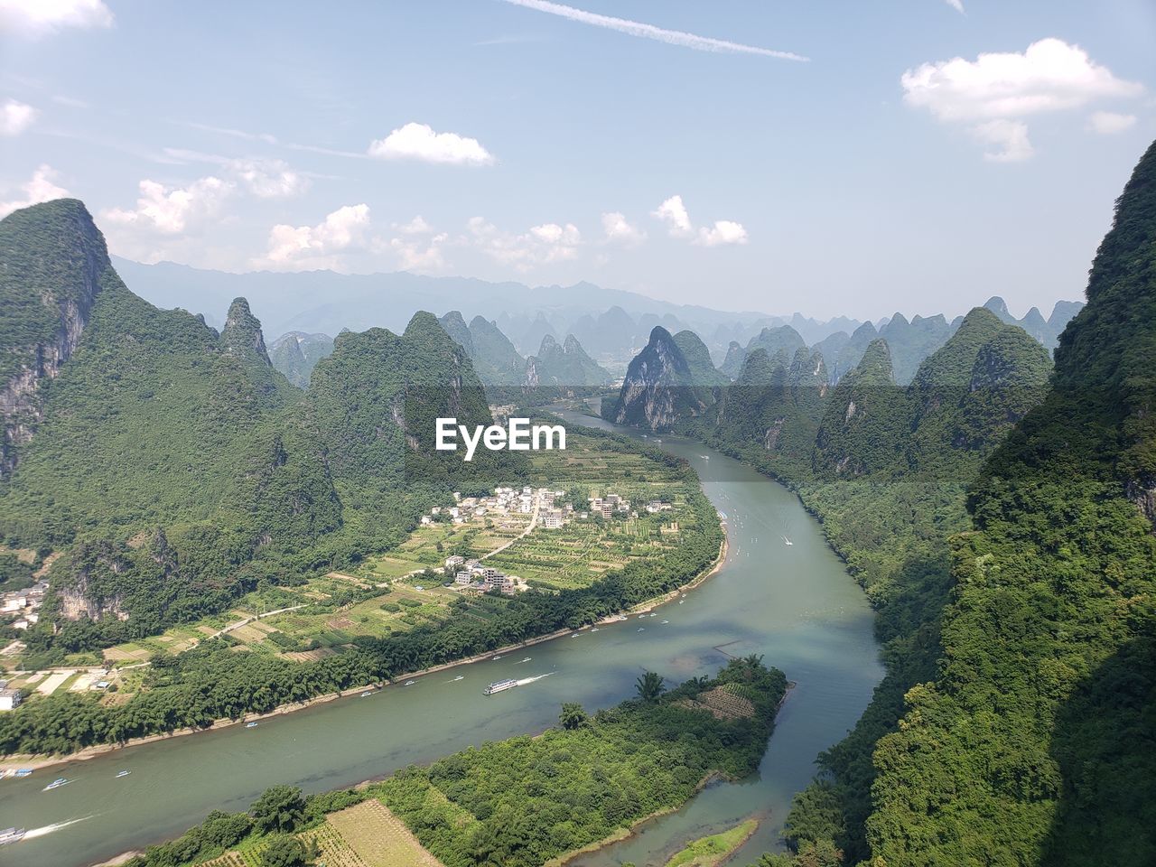 Scenic view of landscape and mountains against sky