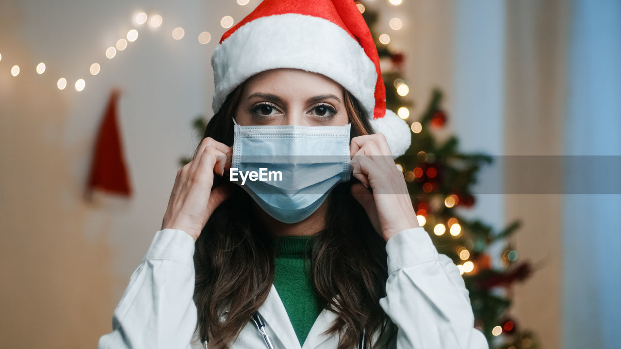 Doctor with mask on christmas background