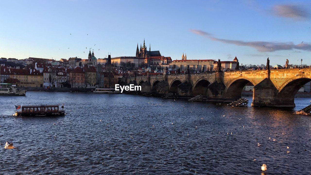 View of bridge over river in city