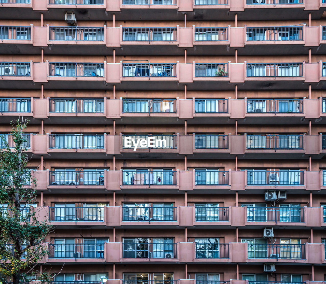 LOW ANGLE VIEW OF RESIDENTIAL BUILDING