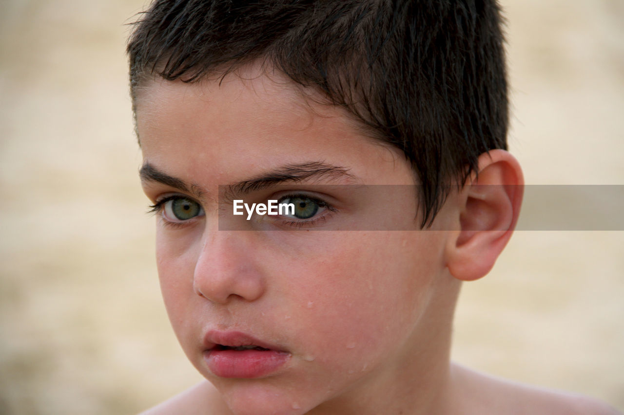 Close-up of thoughtful boy looking away