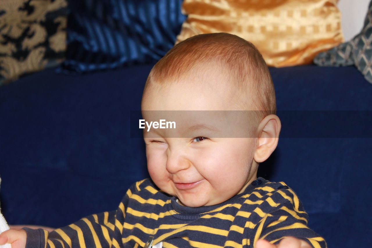 Smiling baby boy at home