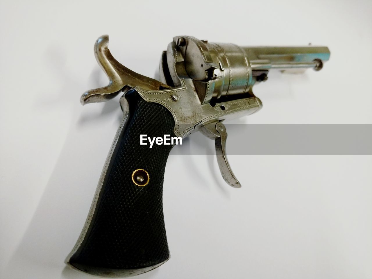 Close-up of gun against white background