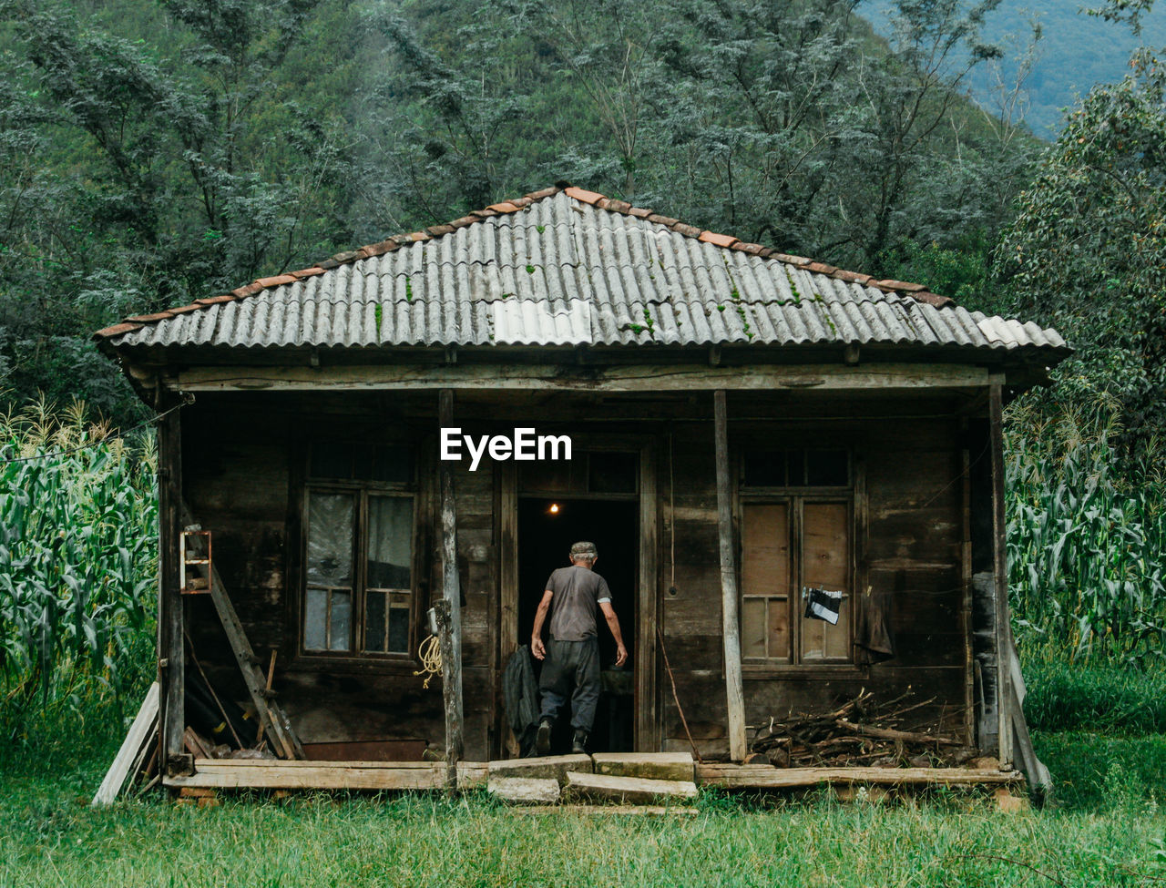 Full length of man outside house
