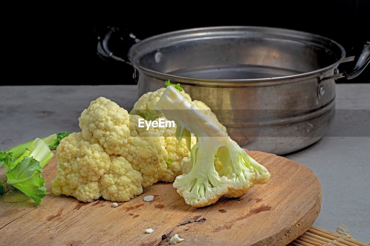 food and drink, food, healthy eating, vegetable, dish, freshness, produce, wellbeing, wood, indoors, studio shot, cuisine, no people, kitchen utensil, cauliflower, household equipment, cutting board, still life, meal