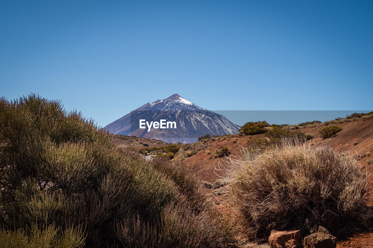 scenic view of mountain against clear blue sky