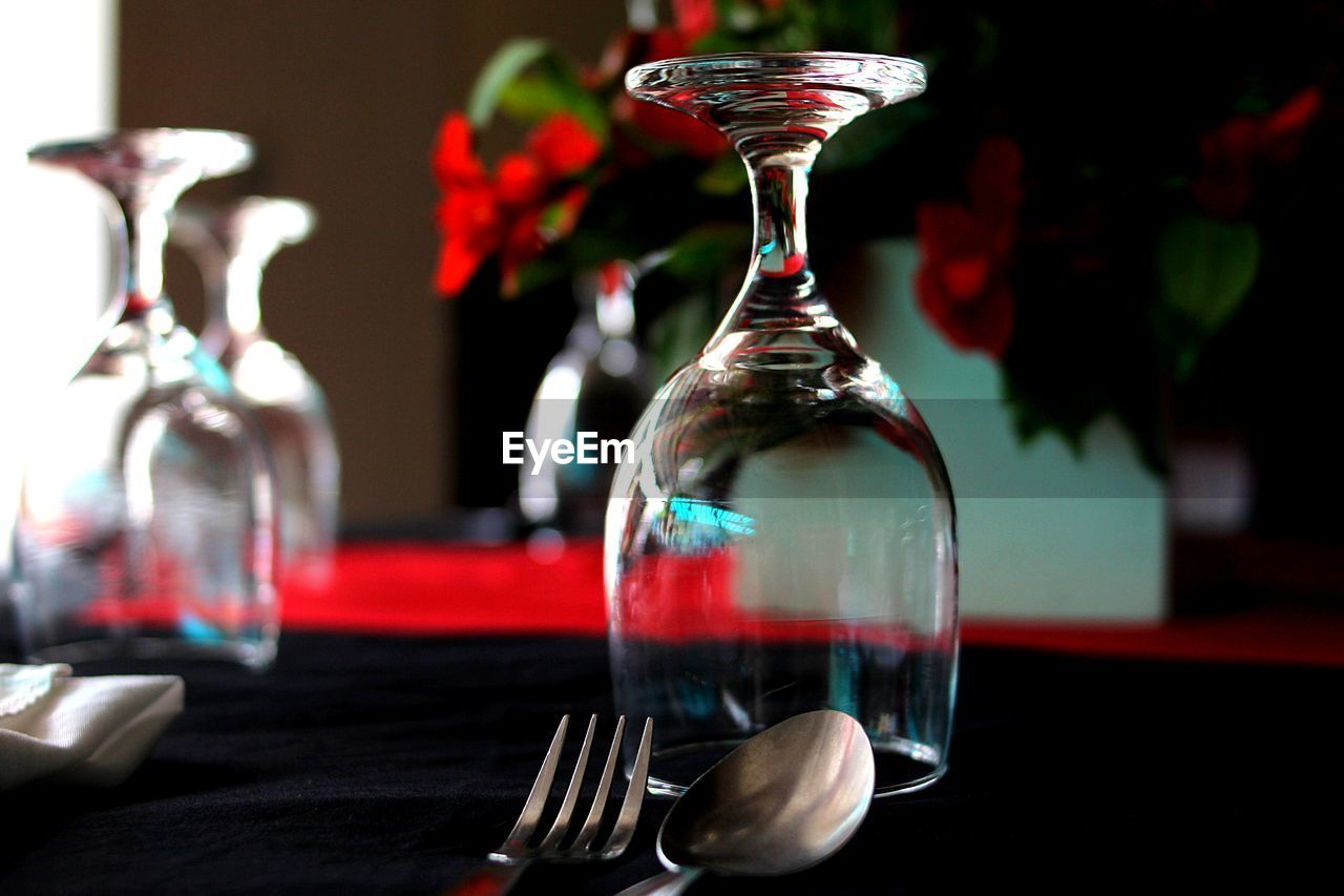 Close-up of upside down wineglass on table