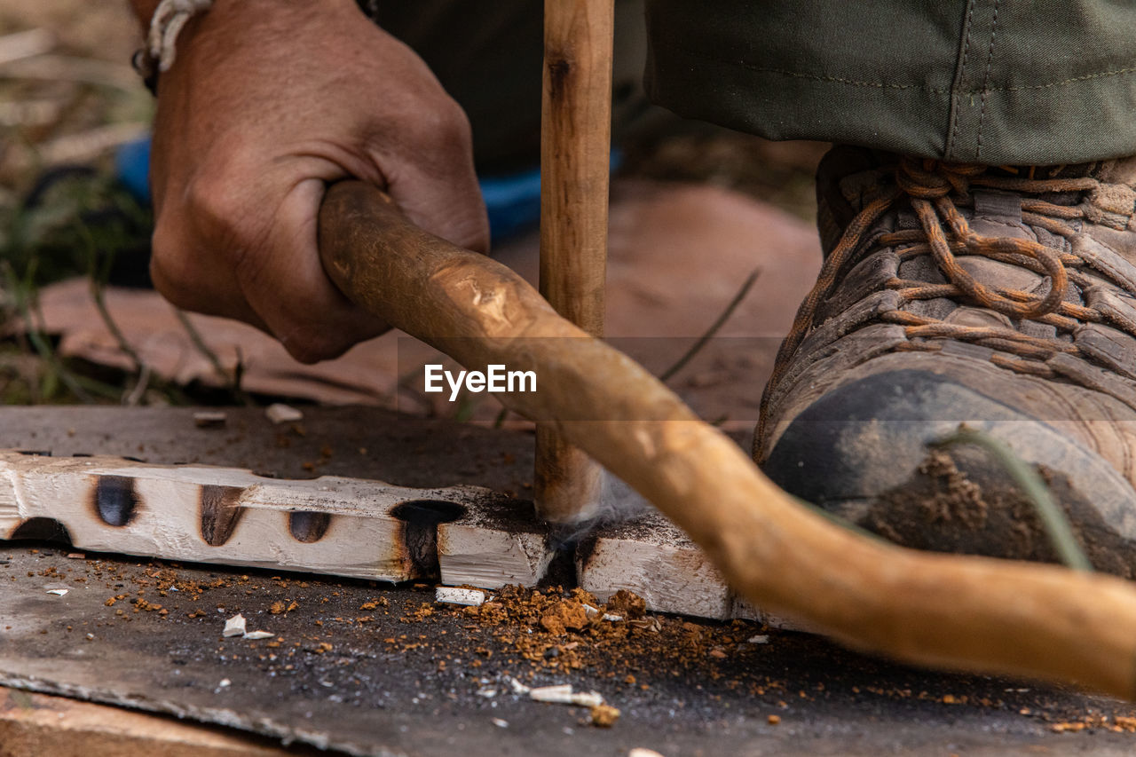 Close-up of man working on wood