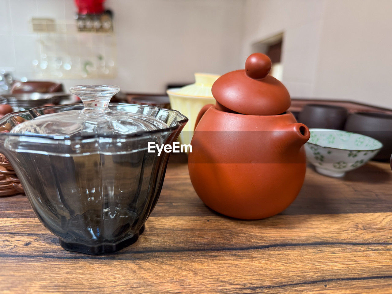food and drink, table, teapot, indoors, wood, household equipment, food, ceramic, no people, drink, still life, hot drink, tea, kitchen utensil, tableware, cup, container, crockery, art, mug, kettle, tea cup, healthy eating, close-up, lighting, bowl, refreshment