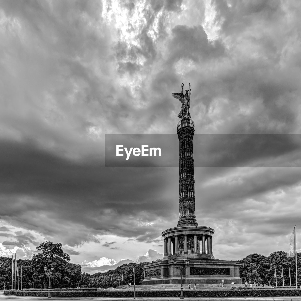 Low angle view of victory column against cloudy sky