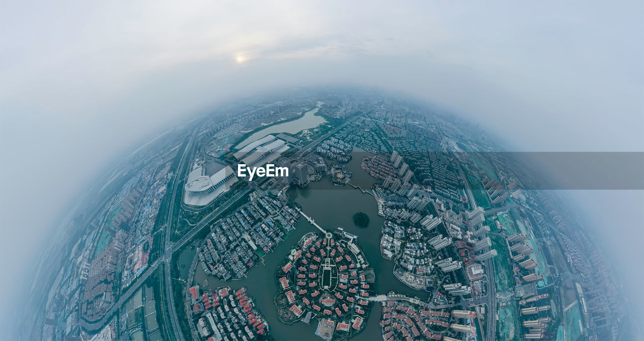 Spherical panoramic image of city buildings and sky