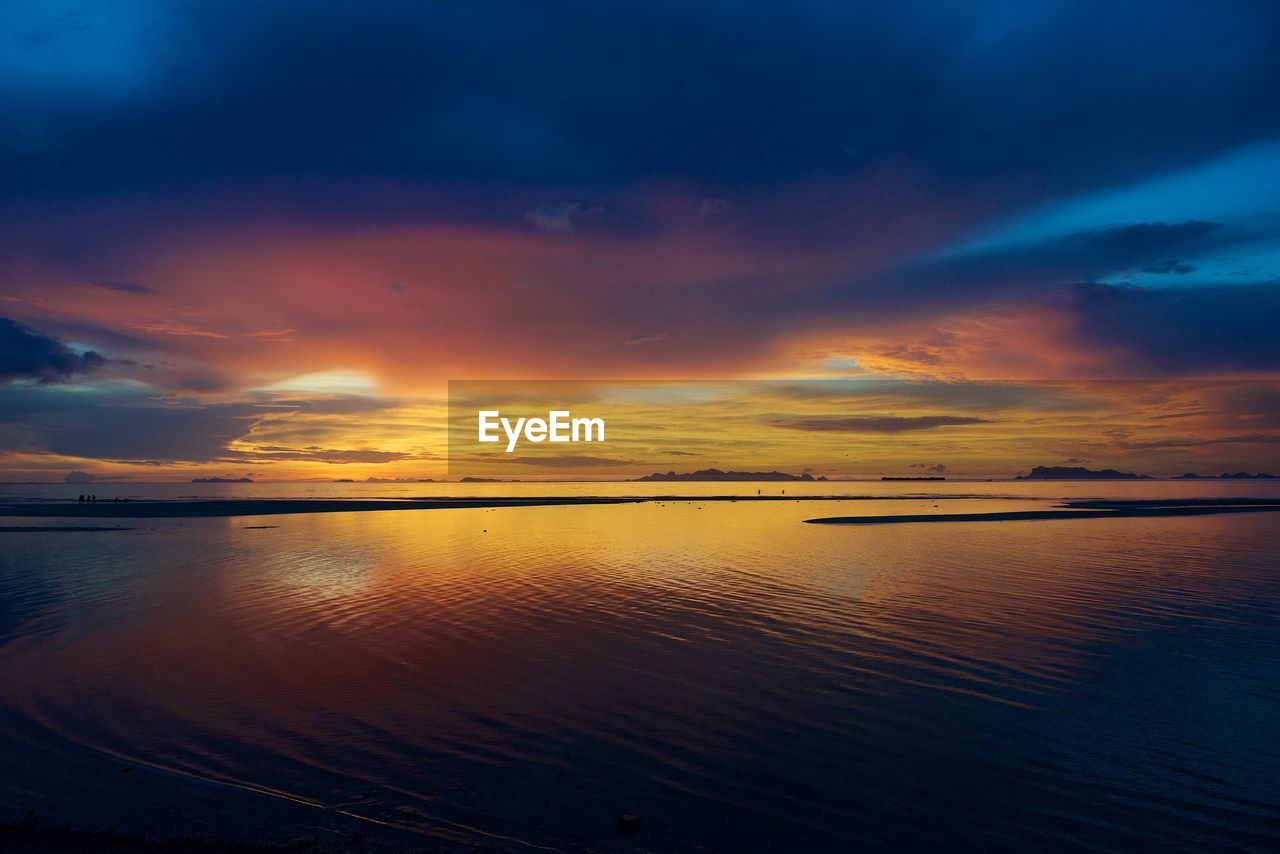 Scenic view of sea against sky at sunset