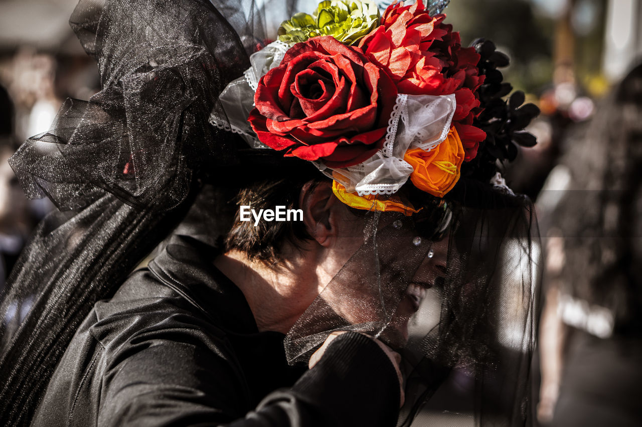 CLOSE UP OF MASK WITH RED AND YELLOW