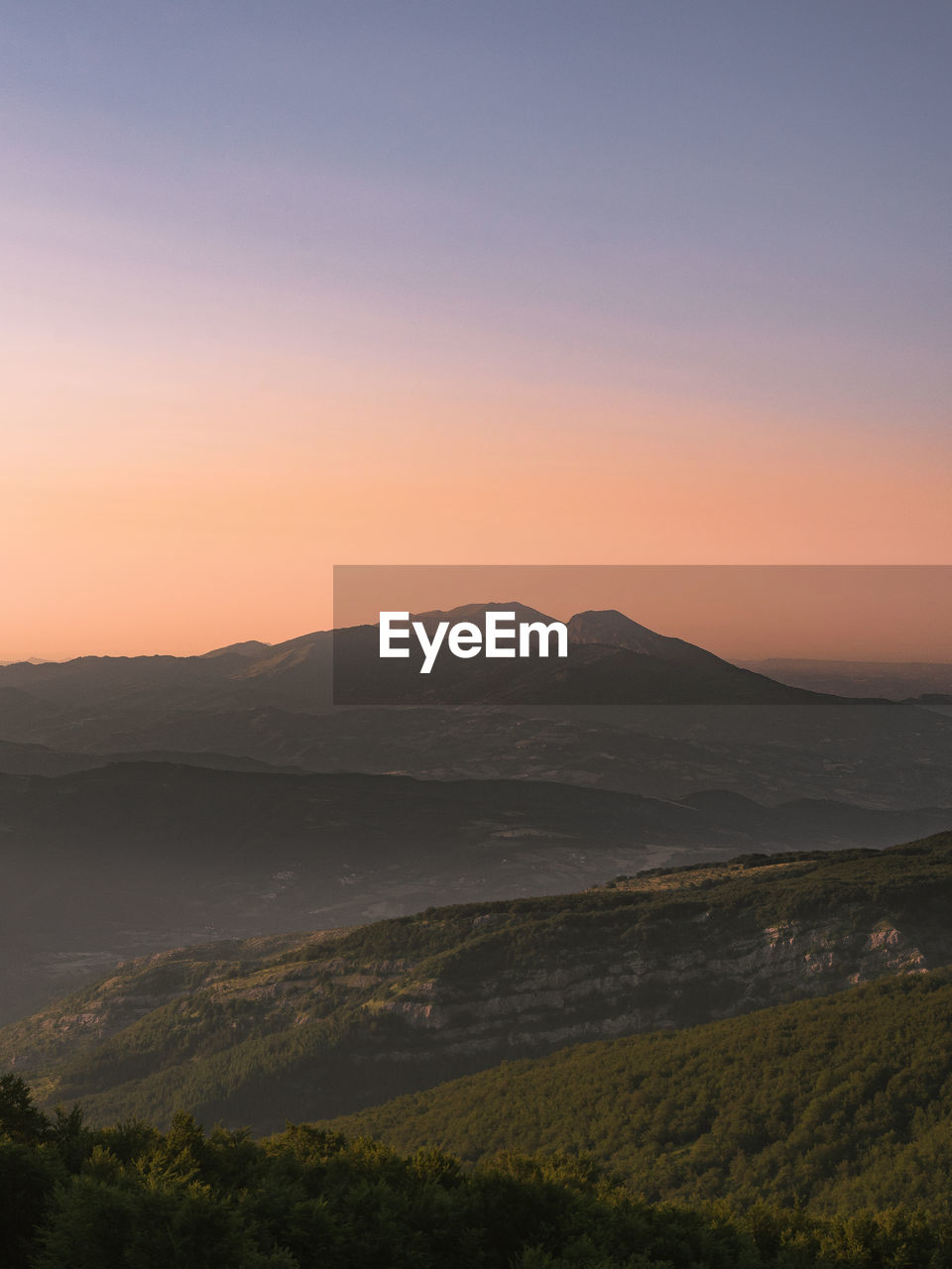 SCENIC VIEW OF LANDSCAPE AGAINST SKY DURING SUNSET