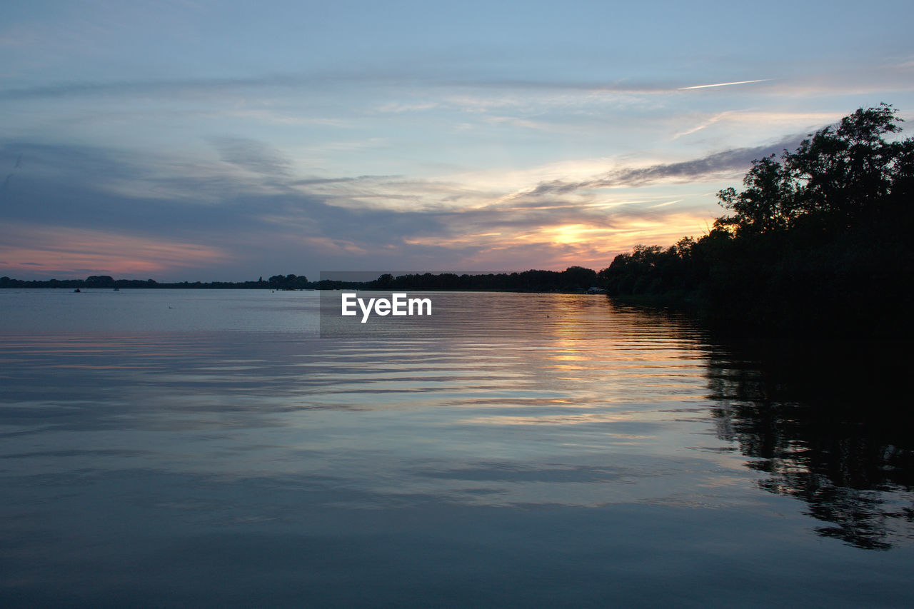 VIEW OF LAKE AGAINST SKY DURING SUNSET