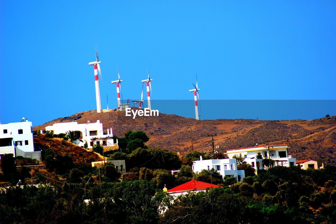 WINDMILL AGAINST CLEAR BLUE SKY