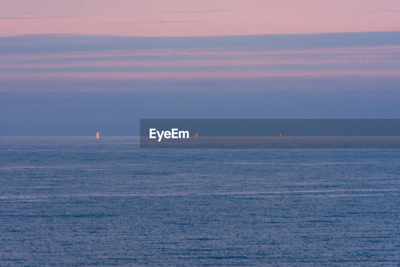 boats in sea against sky