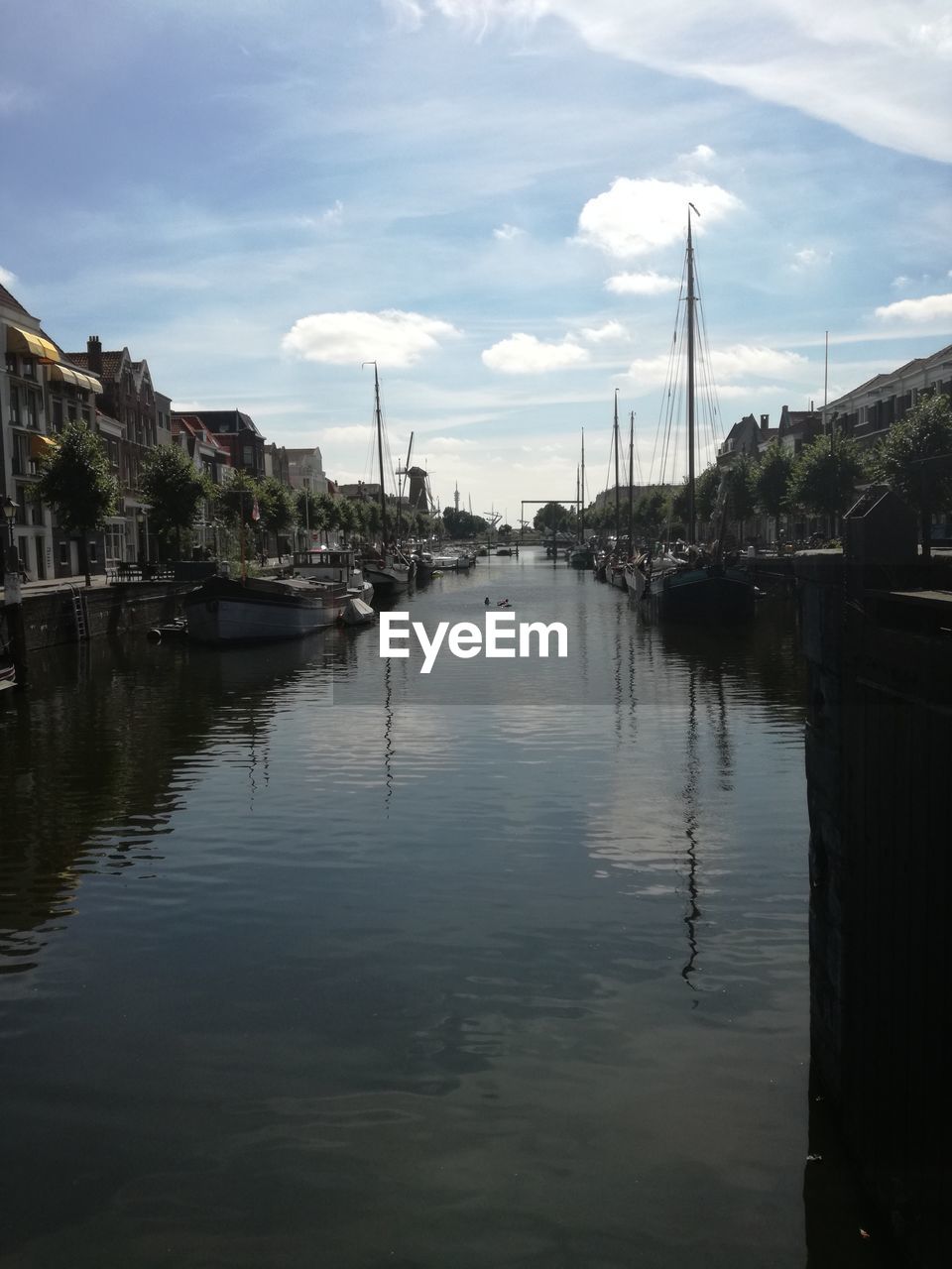 VIEW OF CANAL ALONG BUILDINGS IN CITY