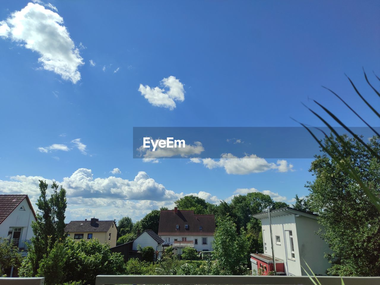 architecture, building exterior, built structure, building, house, sky, residential district, cloud, tree, nature, residential area, blue, plant, city, home, home ownership, suburb, no people, mansion, outdoors, day, front or back yard, roof