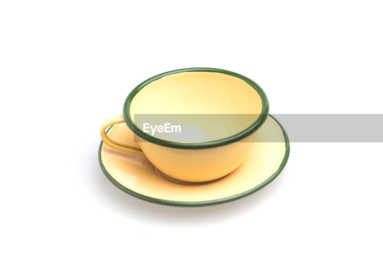 HIGH ANGLE VIEW OF TEA CUP WITH WHITE BACKGROUND