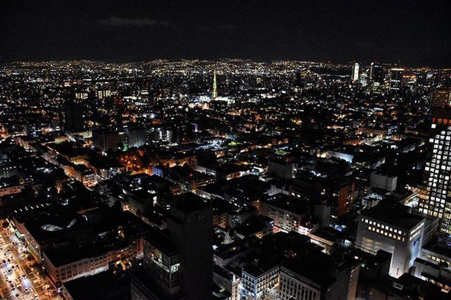 VIEW OF CITYSCAPE AT NIGHT