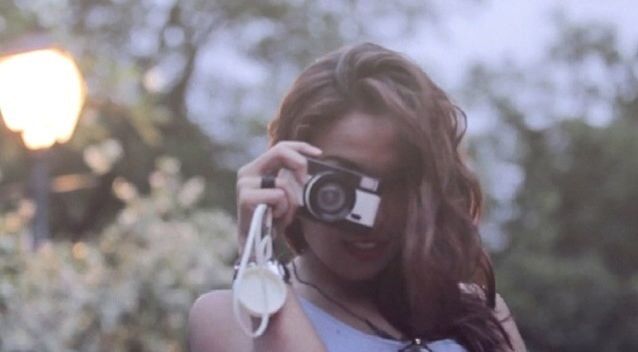 Young woman photographing