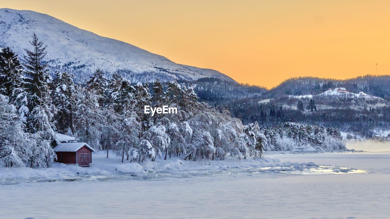 Scenic view of snow covered landscape against sky