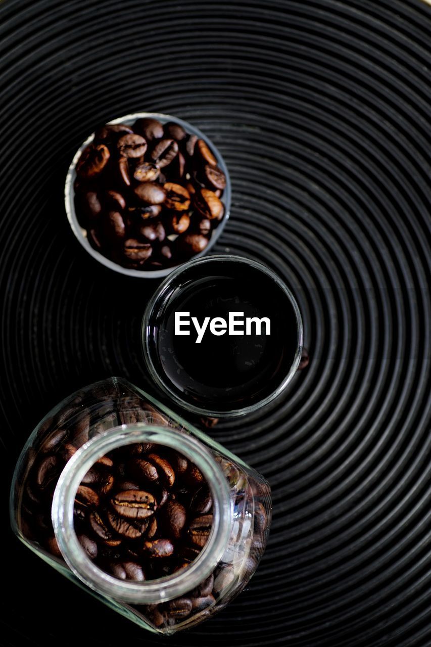 Black coffee and coffee beans, hight angle